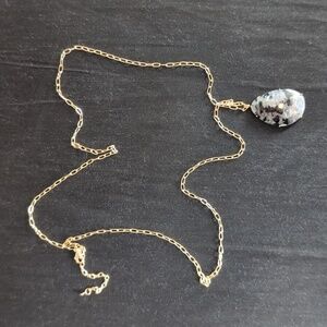 Elegant Gold Necklace with Black and Gray Pendant
